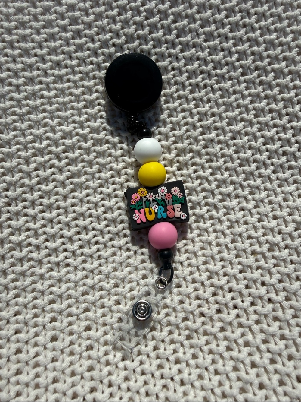 Colorful 'NURSE' Badge Reel with Floral Design